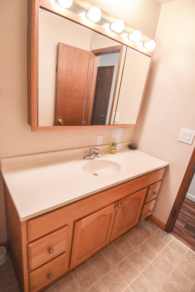 bathroom featuring tile patterned floors and vanity