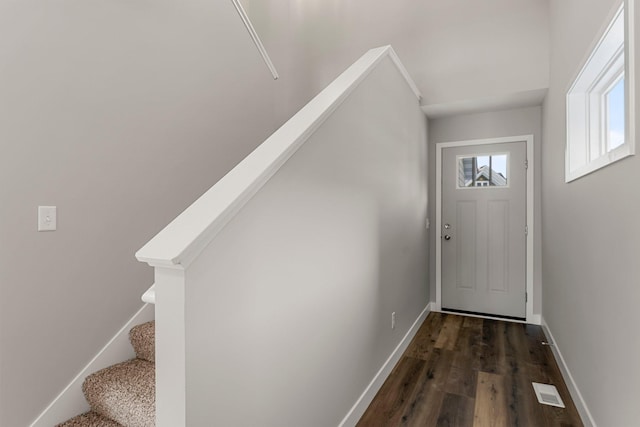 doorway to outside featuring dark hardwood / wood-style flooring