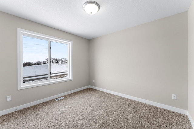 unfurnished room featuring carpet flooring