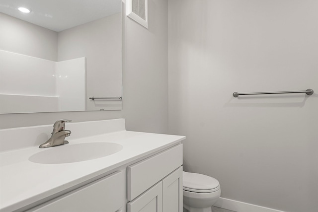 bathroom featuring vanity and toilet