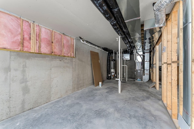 basement with gas water heater and heating unit