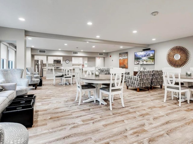 dining room with light wood-type flooring