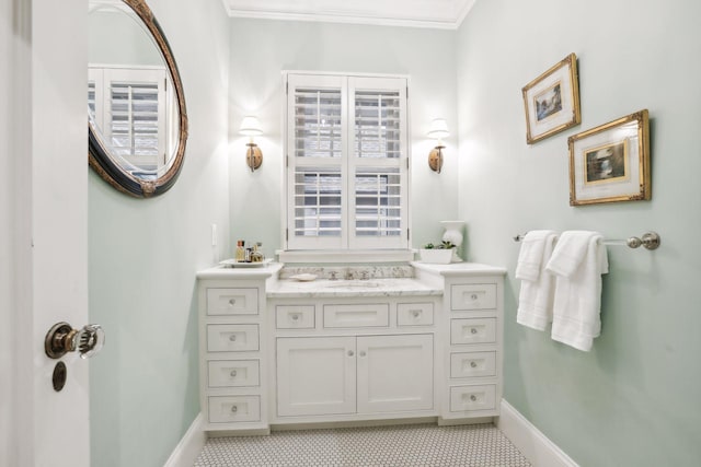 bathroom with vanity and crown molding