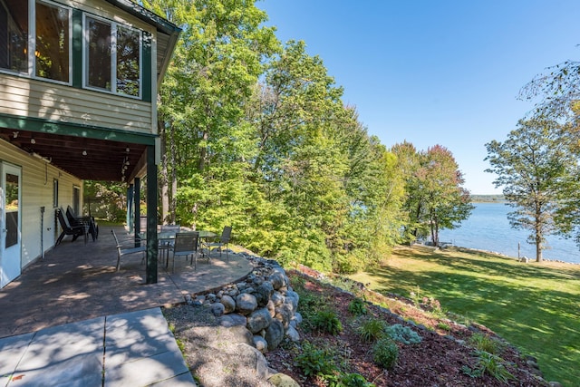 27734 Ridgewood Dr, Merrifield, MN 56465 - view of yard featuring a patio area and a water view