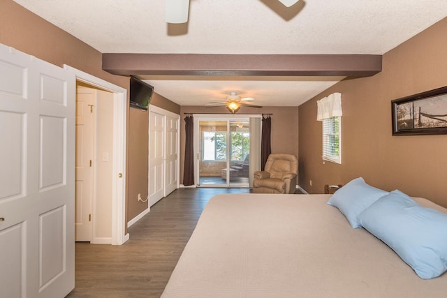 27734 Ridgewood Dr, Merrifield, MN 56465 - bedroom featuring a ceiling fan, baseboards, access to outside, beam ceiling, and dark wood-style floors