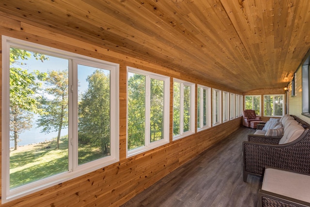 sunroom featuring lofted ceiling and wooden ceiling