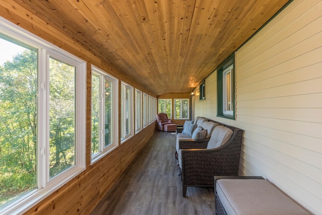 sunroom / solarium featuring wooden ceiling and a healthy amount of sunlight