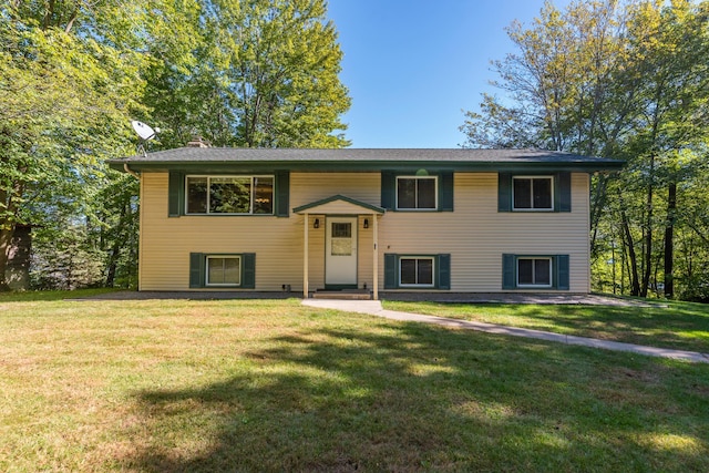 raised ranch featuring a front yard