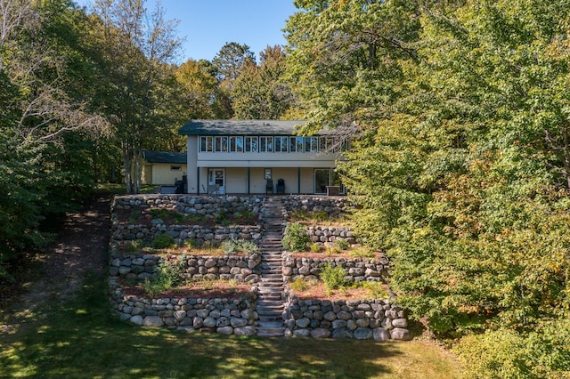 27734 Ridgewood Dr, Merrifield, MN 56465 - back of property featuring a deck and a forest view