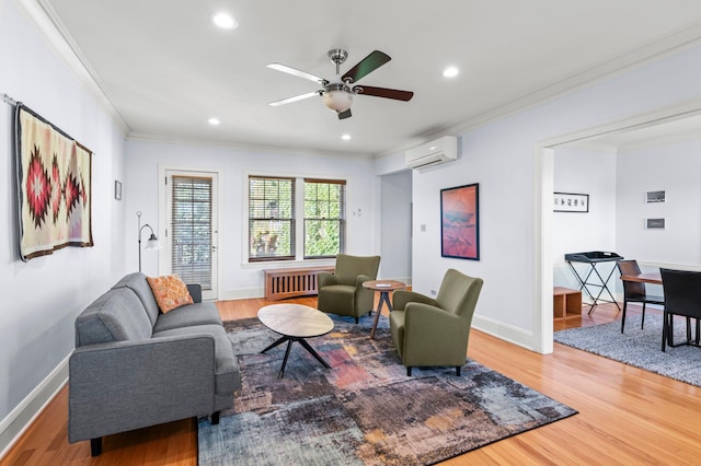 living room featuring wood-type flooring, radiator, ornamental molding, and a wall mounted air conditioner