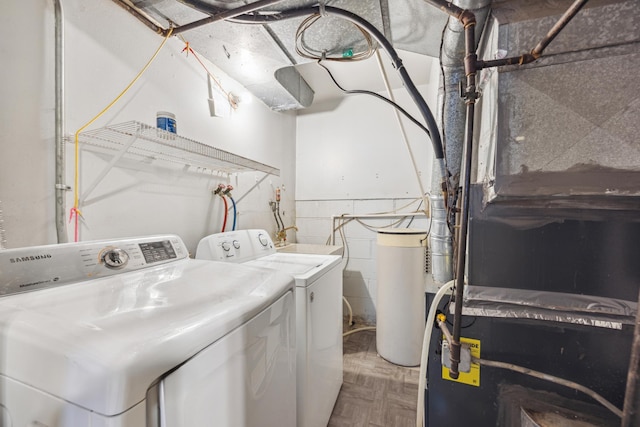 laundry room featuring independent washer and dryer and parquet flooring