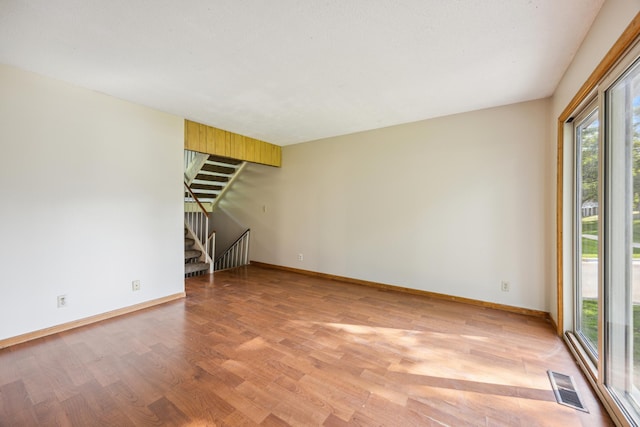 unfurnished living room with light hardwood / wood-style floors