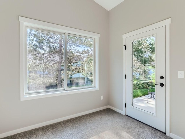 doorway featuring carpet floors