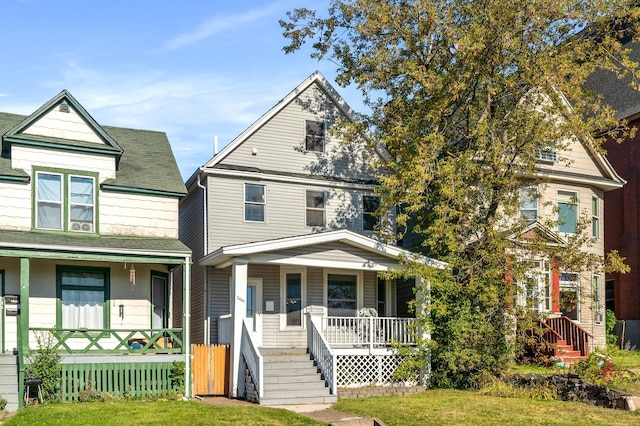 view of front of house featuring a front lawn and covered porch