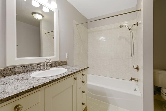 full bathroom with vanity, toilet, and tiled shower / bath