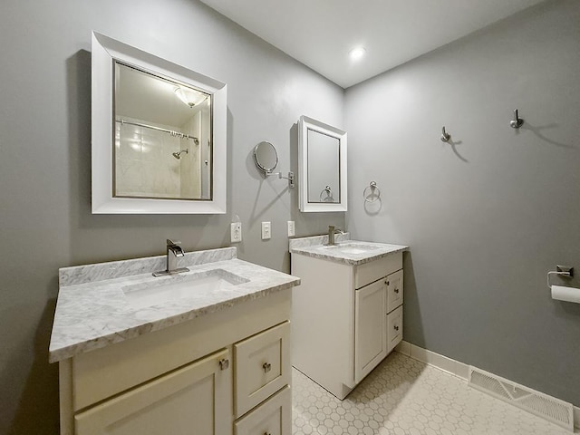 bathroom with vanity and a shower