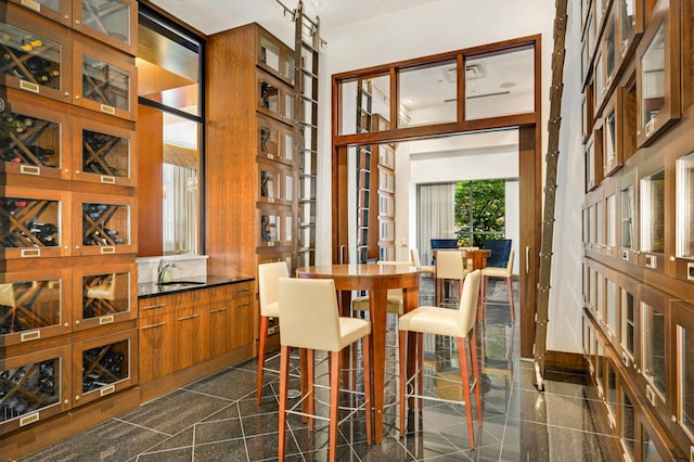 dining space with a wealth of natural light and sink