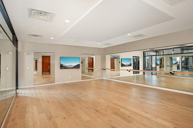 workout area featuring light hardwood / wood-style floors