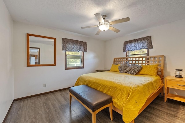 bedroom with a textured ceiling, ceiling fan, wood finished floors, and baseboards