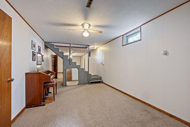 interior space featuring carpet, crown molding, stairway, a textured ceiling, and baseboards