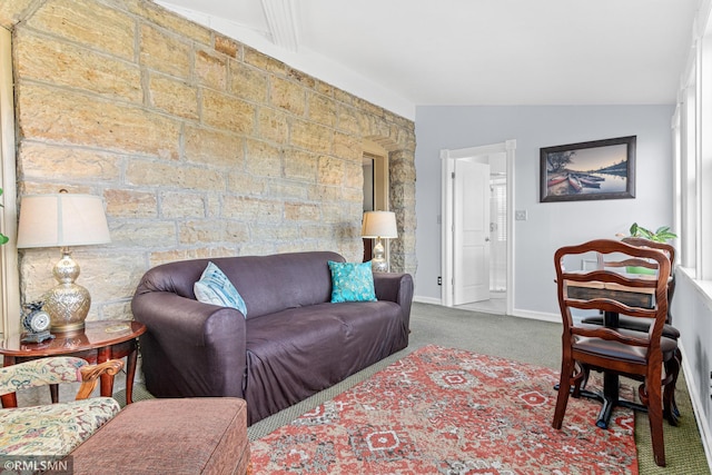 carpeted living room with lofted ceiling