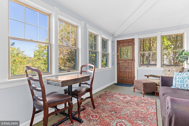 sunroom with vaulted ceiling with beams and plenty of natural light