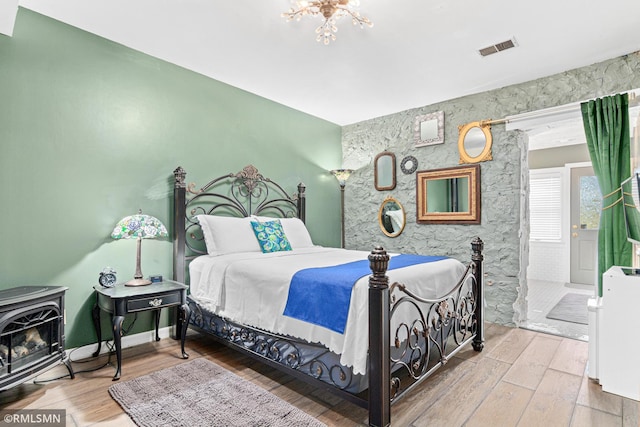 bedroom with hardwood / wood-style floors