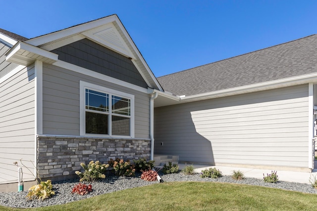 view of exterior entry featuring a yard