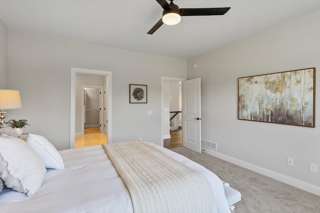 carpeted bedroom with ceiling fan