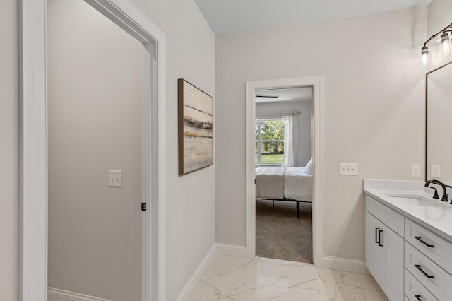 bathroom with a textured ceiling and vanity