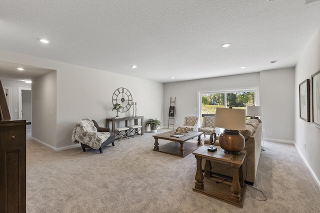 living room featuring light carpet and a textured ceiling