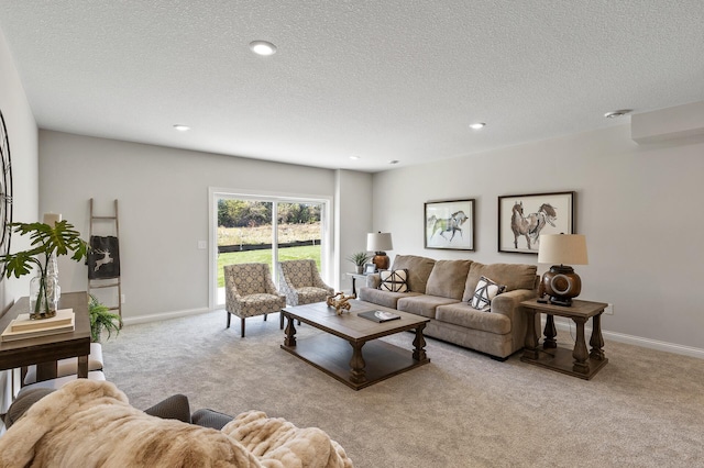 living room featuring light carpet and a textured ceiling