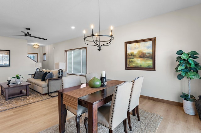 dining space featuring ceiling fan and light wood-type flooring