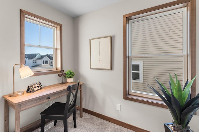 home office with light colored carpet