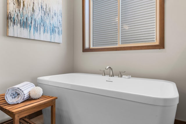 bathroom featuring a washtub