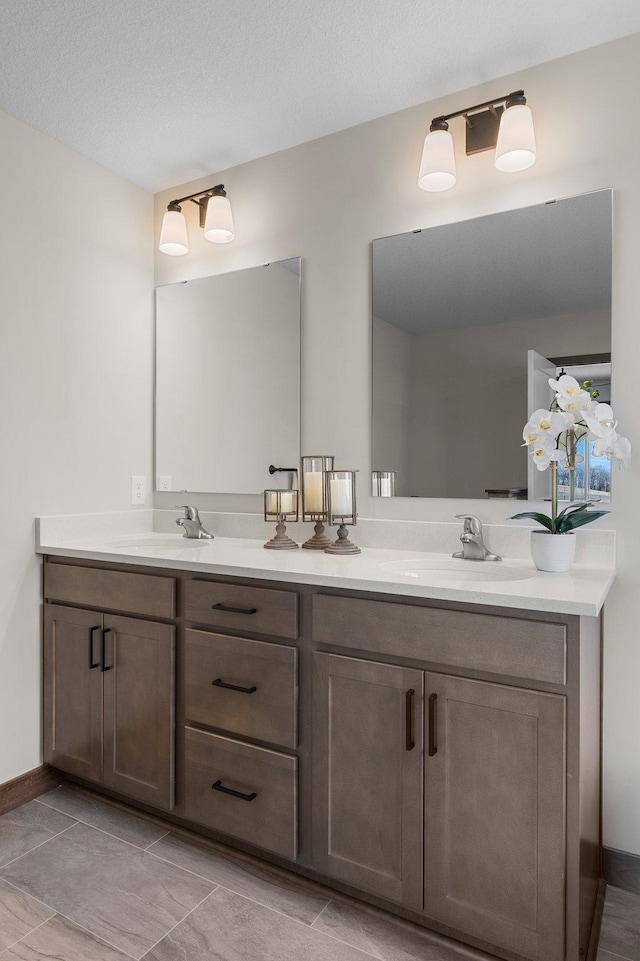 bathroom featuring vanity and a textured ceiling