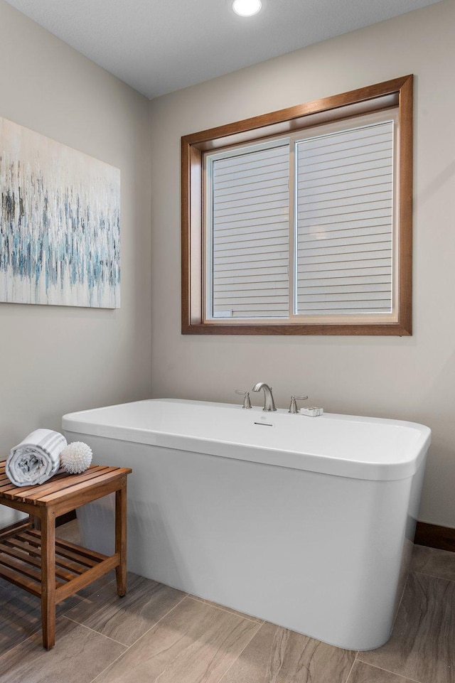 bathroom with a tub