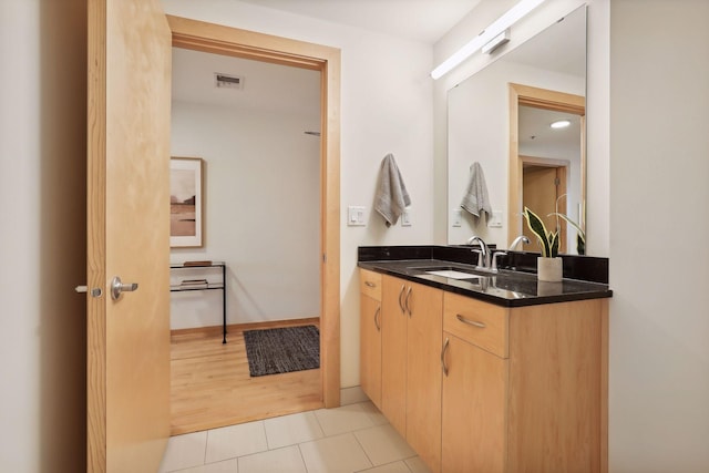 bathroom with vanity and wood-type flooring