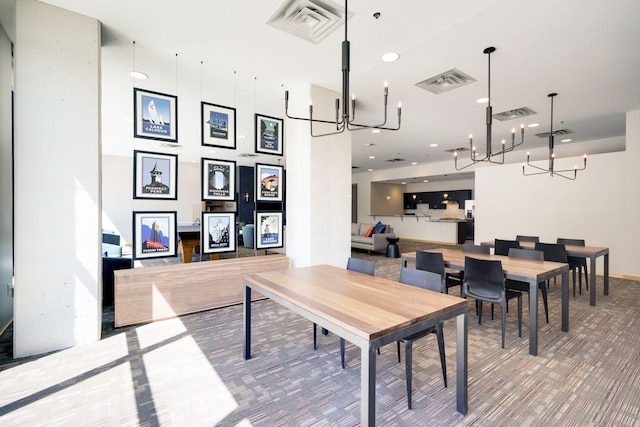 dining space with a chandelier