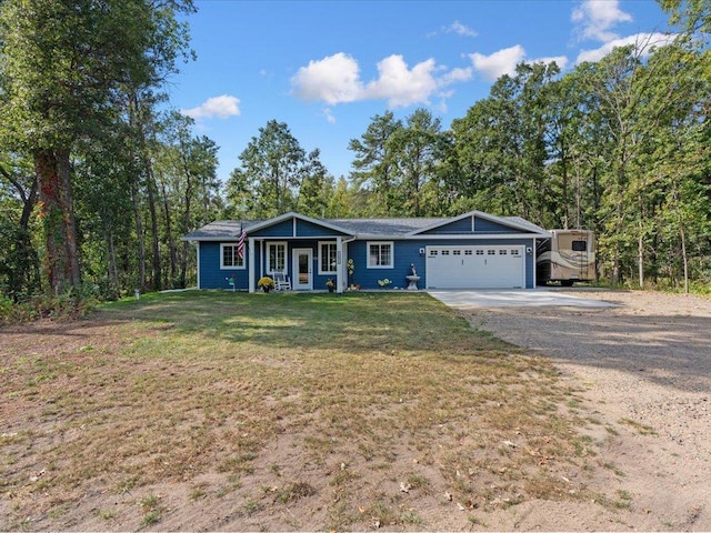 single story home with a front yard, a garage, a porch, and a carport