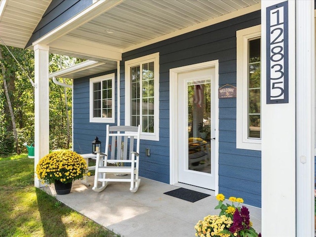 entrance to property with covered porch