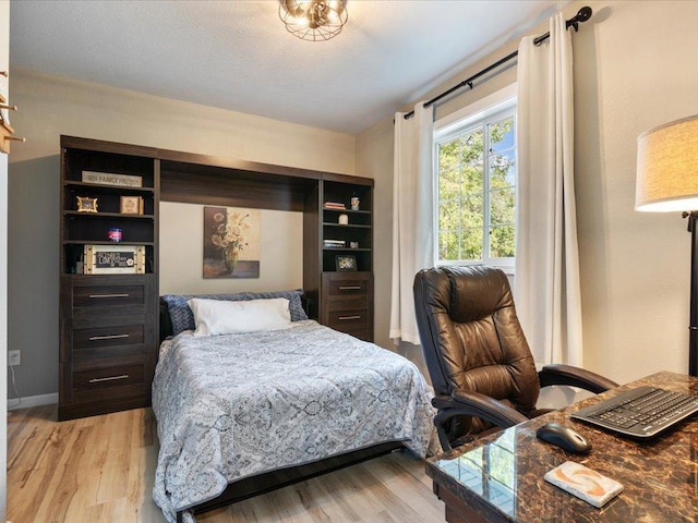 bedroom with light hardwood / wood-style floors