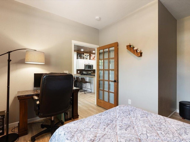 bedroom with light hardwood / wood-style flooring