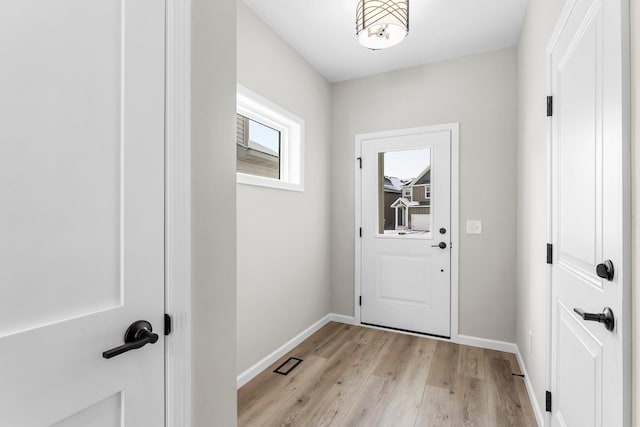 doorway with light hardwood / wood-style flooring