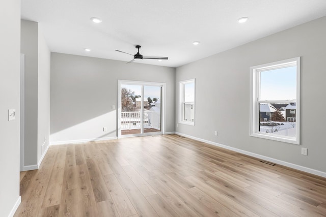 unfurnished room featuring ceiling fan and light hardwood / wood-style floors