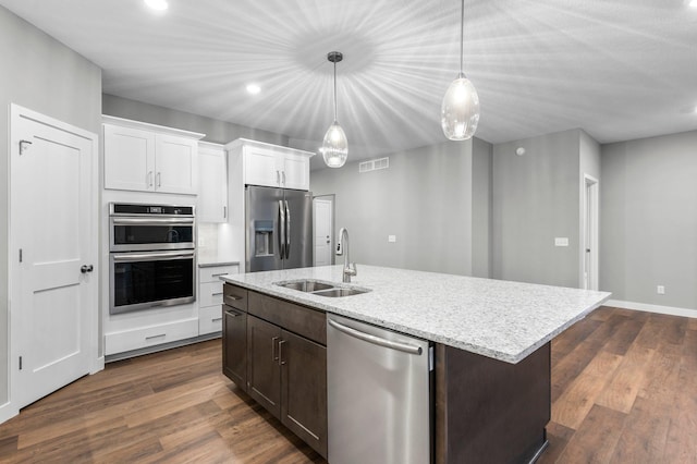 kitchen featuring dark hardwood / wood-style flooring, stainless steel appliances, white cabinetry, and sink