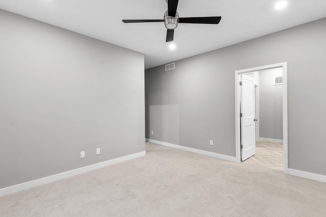 carpeted empty room with ceiling fan