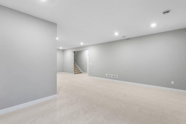 basement with light colored carpet