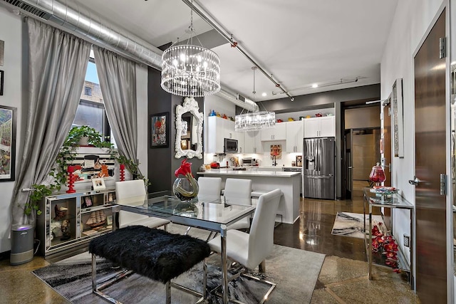 dining room featuring rail lighting