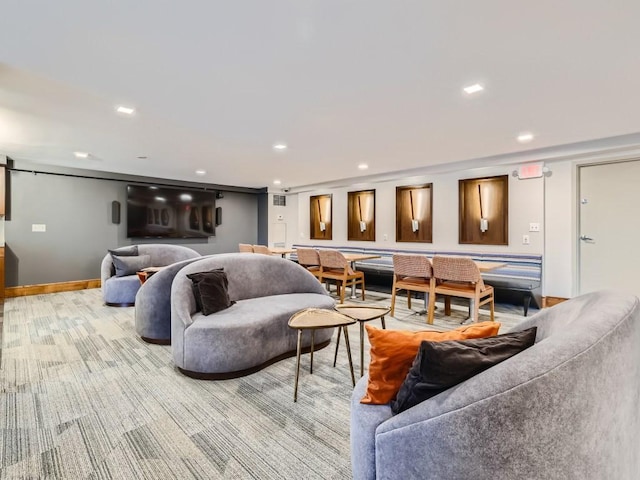 living area with light carpet, baseboards, and recessed lighting